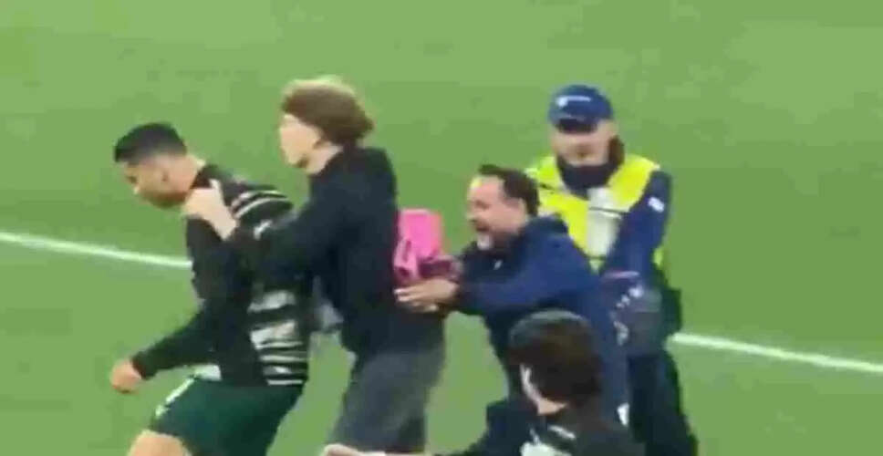 Cristiano Ronaldo's Close Call with a Pitch Invader During UEFA Match