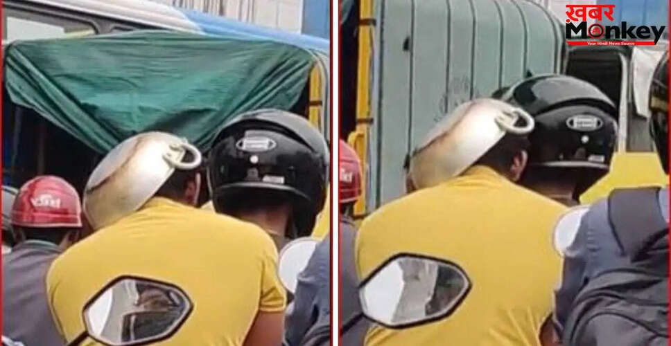 बेंगलुरु में युवक ने कढ़ाही पहनकर बाइक चलाकर किया ट्रैफिक नियमों का उल्लंघन